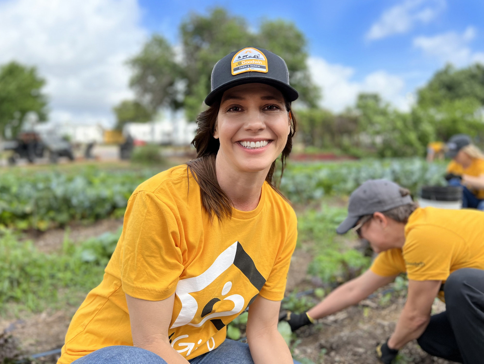 A JBGoodwin Austin agent volunteers at a community for the formerly homeless.